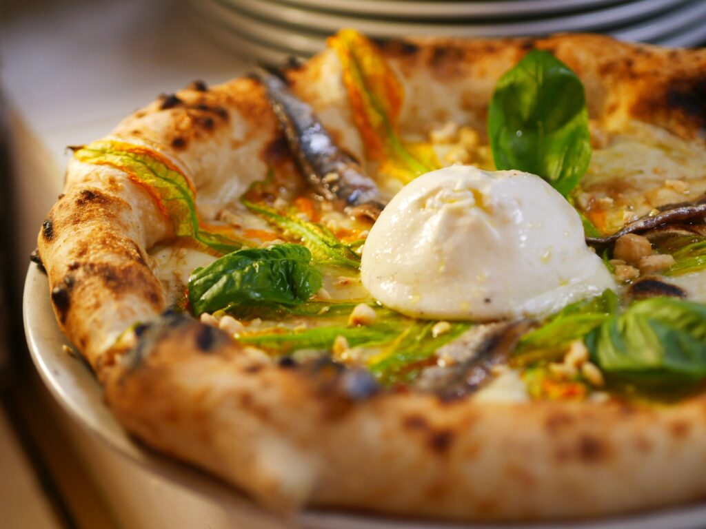 Cucina Conviviale's pizza, is our favorite, to be paired with a natural wine tastings in Florence