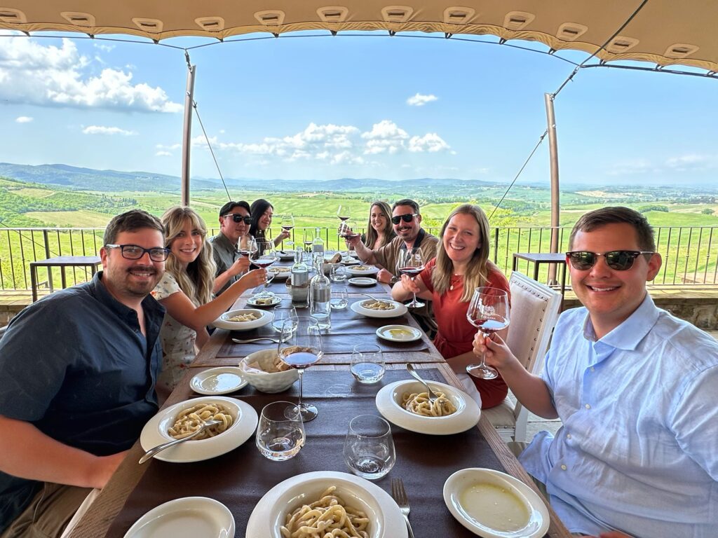 Wine tasting in Tuscany overlooking vineyards