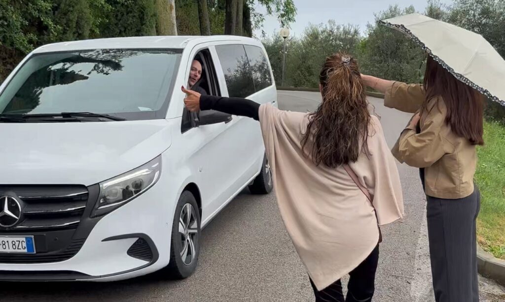 Guests being picked up by a private van during a Tuscany wine tour from Florence.