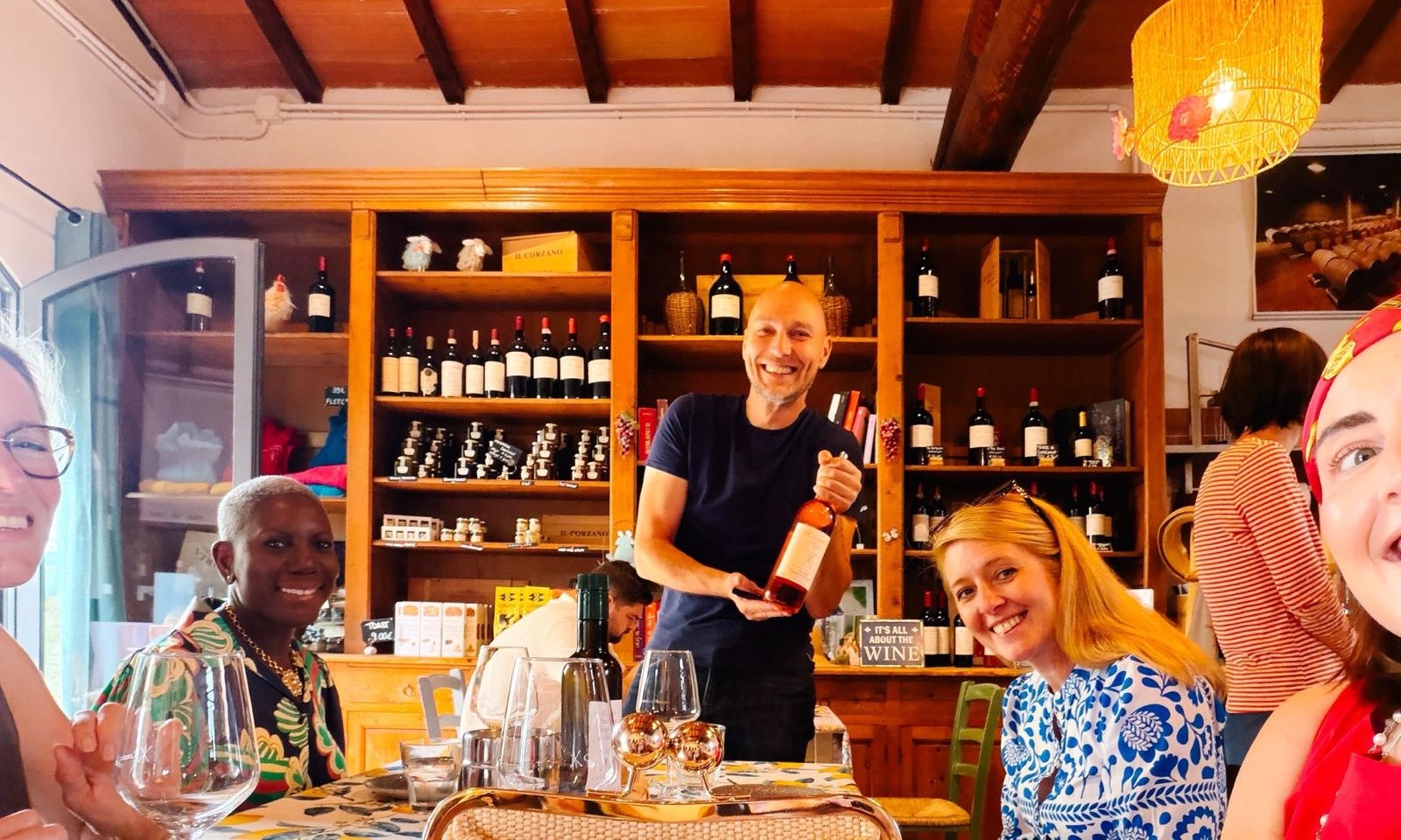 Guests enjoying a guided wine tasting at a Tuscan winery, illustrating how the ideal number of winery visits in one day depends on the region and the pace of the experience.