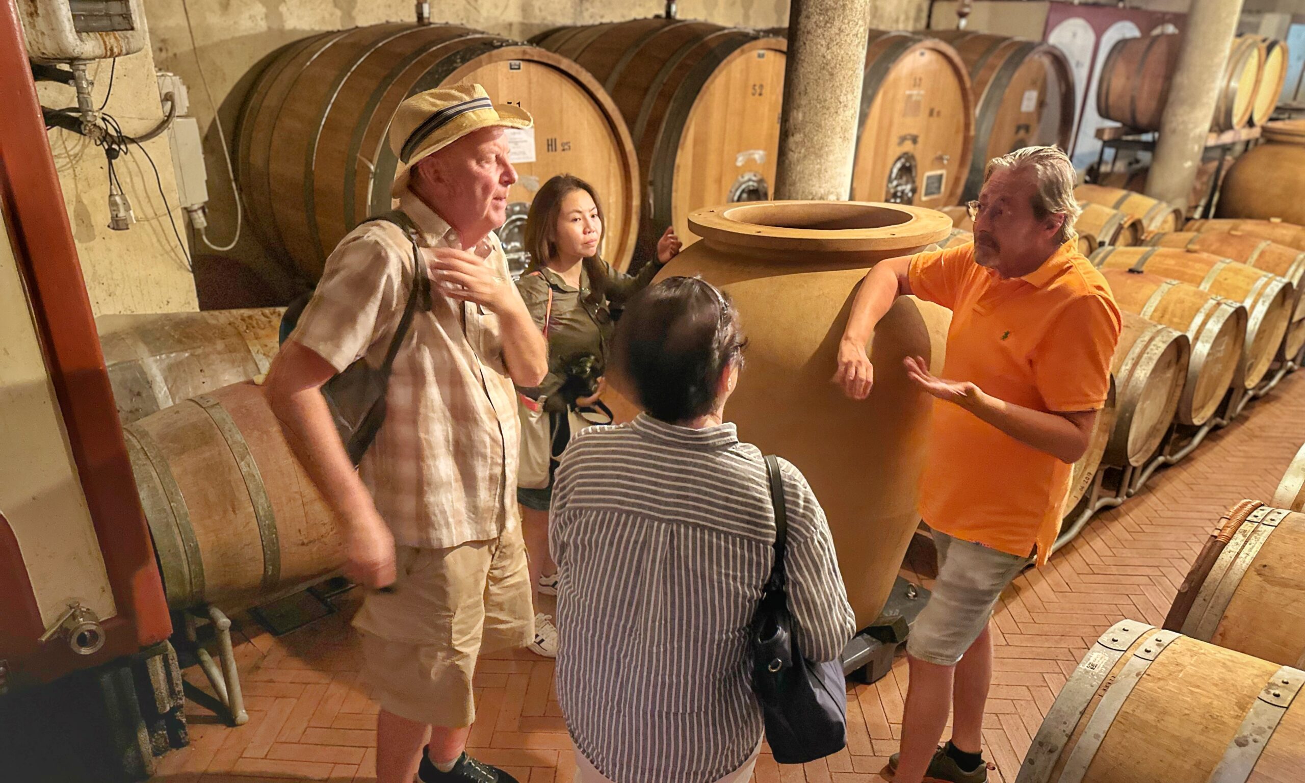 Guests enjoying behind-the-scenes access with a winemaker during a private guided wine tour in Tuscany.